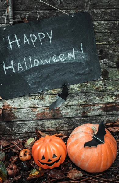 Happy Halloween. Holiday pumpkins and decorations. Pumpkin on autumn street.