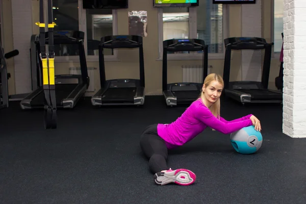 Fitness beautiful girl trainer do some exersice with fitness  equipment