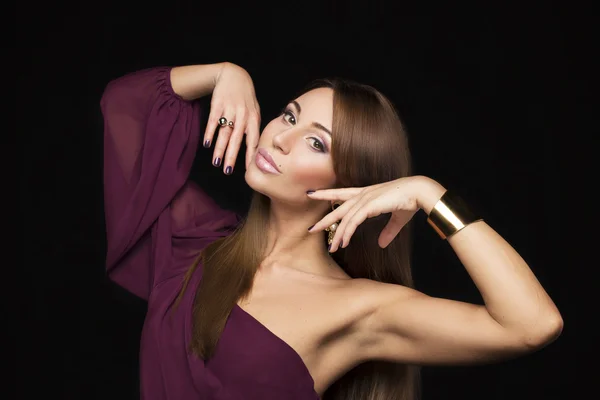 Beauty portrait of a beautiful girl with long hair and jewelry east — Stock Photo, Image