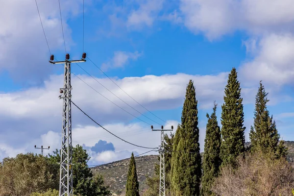 Old electricity pole and blue sky in Turkey.