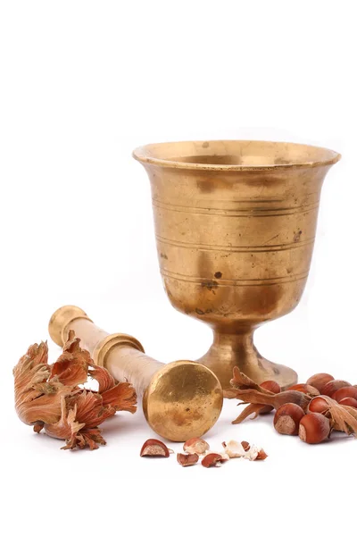 The Hazelnut and in the leaf old metal nutcracker on white backg — Stock Photo, Image