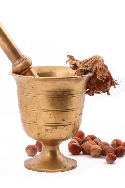 The Hazelnut and in the leaf old metal nutcracker on white backg — Stock Photo, Image