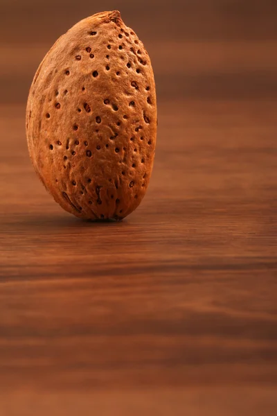 The Almond isolated on the wood — Stock Photo, Image