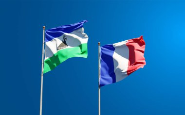 Lesotho ve Fransa 'nın güzel ulusal bayrağı gökyüzü arka planında birlikte. 3B sanat eseri konsepti.