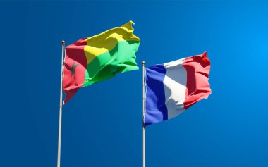 Gökyüzü arka planında Gine Bissau ve Fransa 'nın güzel ulusal bayrakları birlikte. 3B sanat eseri konsepti.
