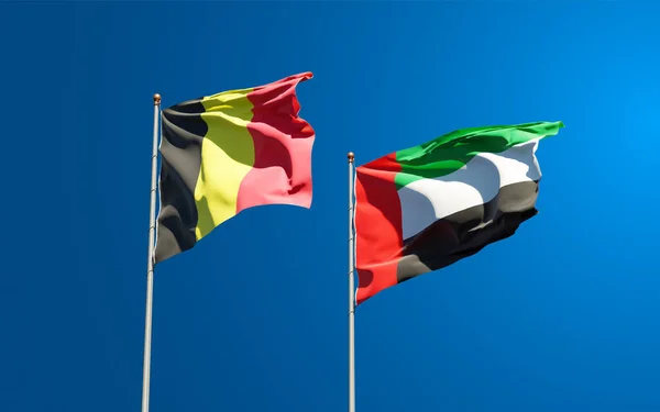 阿联酋和比利时美丽的国旗在天空的背景下共同飘扬 3D艺术品概念 — 图库照片