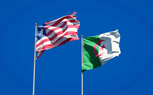 아름다운 라이베리아와 알제리의 국기들이 하늘을 배경으로 있습니다 — 스톡 사진