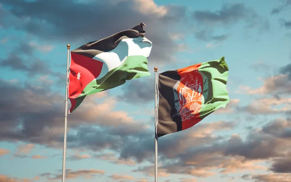 ヨルダンとアフガニスタンの美しい国旗が空を背景に一緒に描かれています 3Dアートワークコンセプト — ストック写真