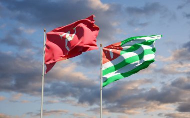 Mann Adası ve Abhazya 'nın güzel ulusal bayrakları gökyüzü arka planında birlikte. 3B sanat eseri konsepti.