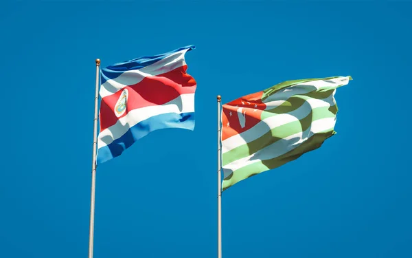 Krásné Národní Vlajky Abcházie Kostariky Společně Pozadí Oblohy Koncept Uměleckých — Stock fotografie