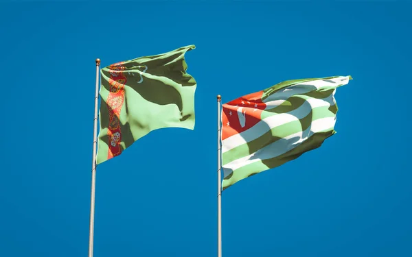 Gyönyörű Nemzeti Zászlók Türkmenisztán Abházia Együtt Hátterében Művészeti Koncepció — Stock Fotó