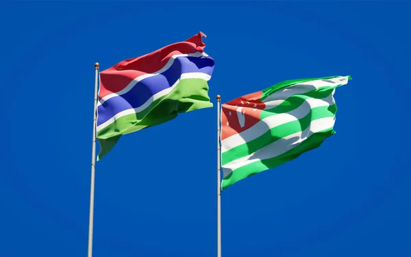 Красивые Национальные Государственные Флаги Гамбии Абхазии Вместе Фоне Неба Концепция — стоковое фото