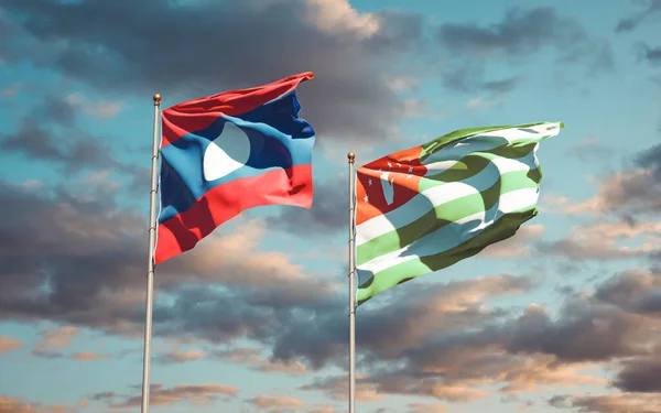 Hermosas Banderas Estatales Nacionales Laos Abjasia Juntas Fondo Del Cielo —  Fotos de Stock
