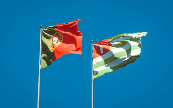 Belas Bandeiras Nacionais Portugal Abcásia Juntas Fundo Céu Conceito Arte — Fotografia de Stock