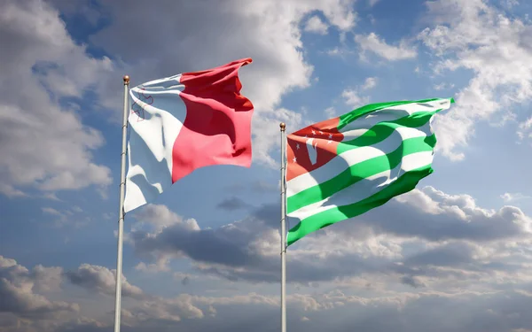 Красивые Национальные Государственные Флаги Мальты Абхазии Вместе Фоне Неба Концепция — стоковое фото