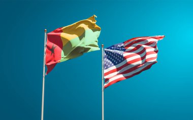 ABD ve Gine-Bissau 'nun güzel ulusal bayrakları gökyüzü arka planında birlikte. 3B sanat eseri konsepti. 