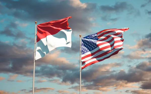 Monako ve ABD 'nin güzel ulusal bayrakları gökyüzü arka planında birlikte. 3B sanat eseri konsepti. 