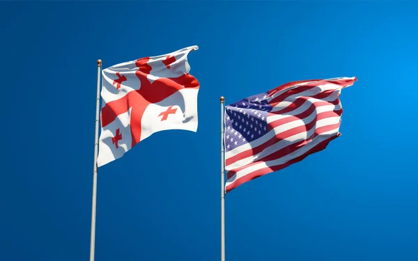 Beautiful national state flags of Georgia and USA together at the sky background. 3D artwork concept.