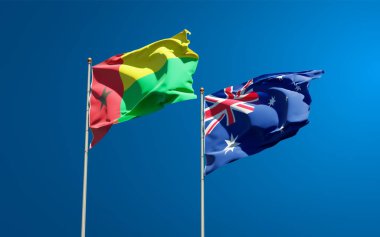 Avustralya ve Gine-Bissau 'nun güzel ulusal bayrakları gökyüzü arka planında birlikte. 3B sanat eseri konsepti. 