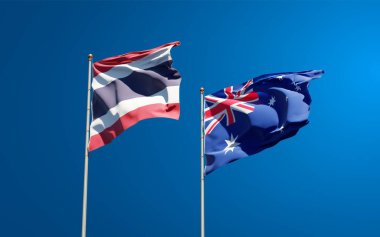 Tayland ve Avustralya 'nın güzel ulusal bayrakları gökyüzü arka planında birlikte. 3B sanat eseri konsepti. 