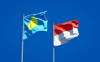 Gökyüzü arka planında Palau ve Endonezya 'nın güzel ulusal bayrakları birlikte. 3B sanat eseri konsepti. 