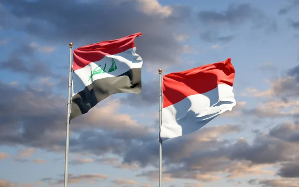 空を背景にイラクとインドネシアの美しい国旗が一緒に 3Dアートワークコンセプト — ストック写真