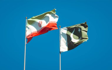 İran ve Pakistan 'ın güzel ulusal bayrakları gökyüzünde birlikte. 3B sanat eseri konsepti. 