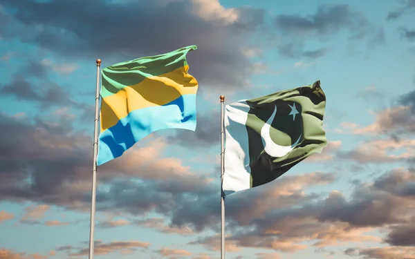 Vackra Nationella Flaggor Gabon Och Pakistan Tillsammans Himlen Bakgrund Konstverkskoncept — Stockfoto