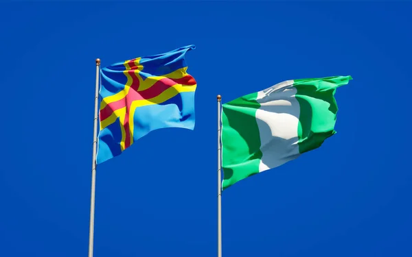 Vackra Nationalstatliga Flaggor Nigeria Och Åland Tillsammans Himlen Bakgrund Konstverkskoncept — Stockfoto