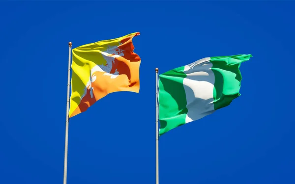Belas Bandeiras Nacionais Estado Nigéria Butão Juntas Fundo Céu Conceito — Fotografia de Stock