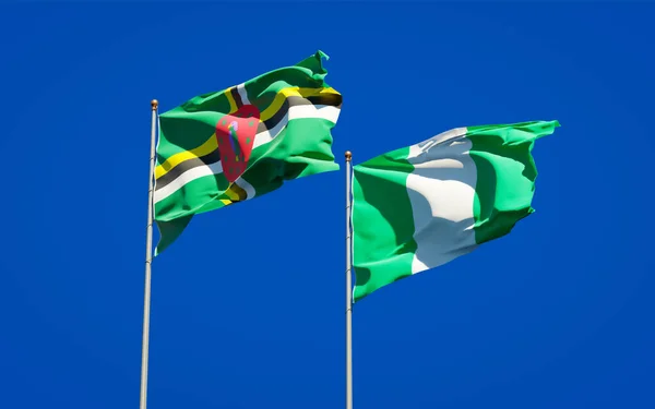 Hermosas Banderas Estatales Nacionales Nigeria Dominica Juntas Fondo Del Cielo — Foto de Stock