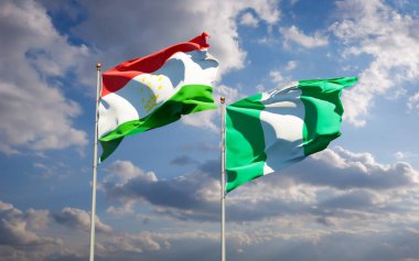 Gökyüzü arka planında Tacikistan ve Nijerya 'nın güzel ulusal bayrakları birlikte. 3B sanat eseri konsepti. 