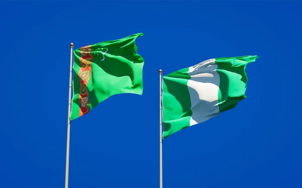 Gyönyörű Nemzeti Zászlók Türkmenisztán Nigéria Együtt Hátterében Művészeti Koncepció — Stock Fotó