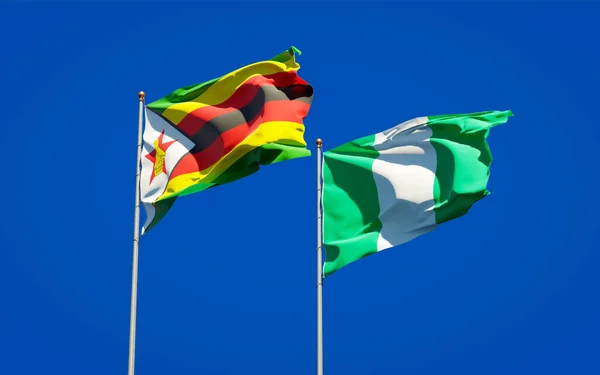 Красивые Национальные Государственные Флаги Зимбабве Нигерии Вместе Фоне Неба Концепция — стоковое фото