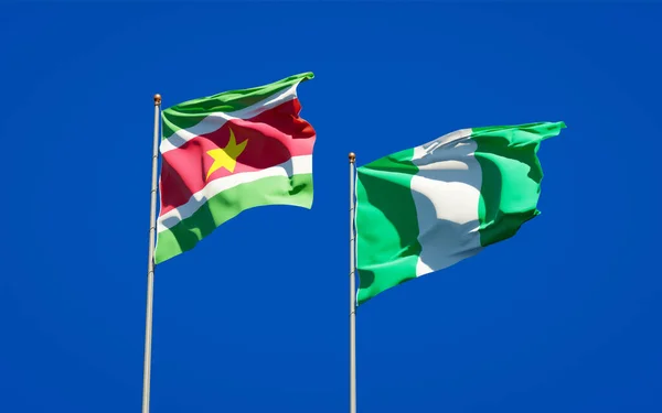 Gyönyörű Nemzeti Zászlók Suriname Nigéria Együtt Hátterében Művészeti Koncepció — Stock Fotó