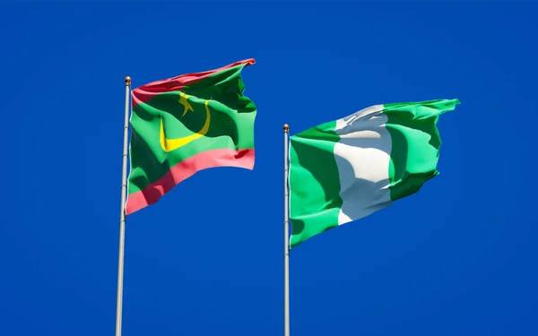 美丽的毛里塔尼亚和尼日利亚国旗在天空的背景下并立在一起 3D艺术品概念 — 图库照片