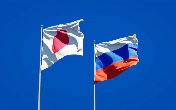 美丽的日本国旗和俄罗斯国旗在天空的背景下连在一起 3D艺术品概念 — 图库照片
