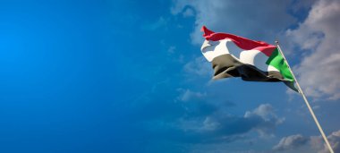 Sudan 'ın boş alanı olan güzel ulusal bayrağı. 3D metin için geniş arkaplanda Sudan bayrağı.