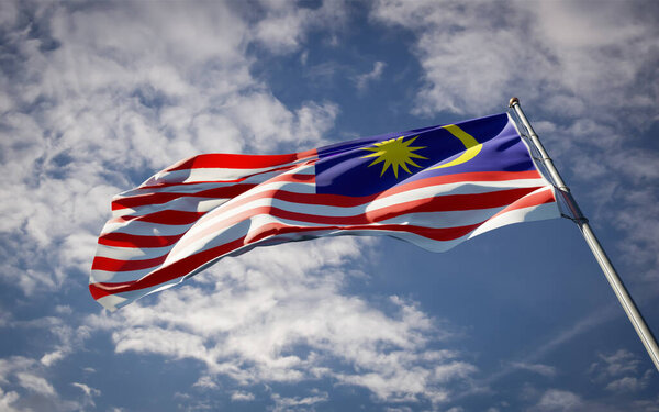 Beautiful national state flag of Malaysia fluttering at sky background. Low angle close-up Malaysia flag 3D artwork.