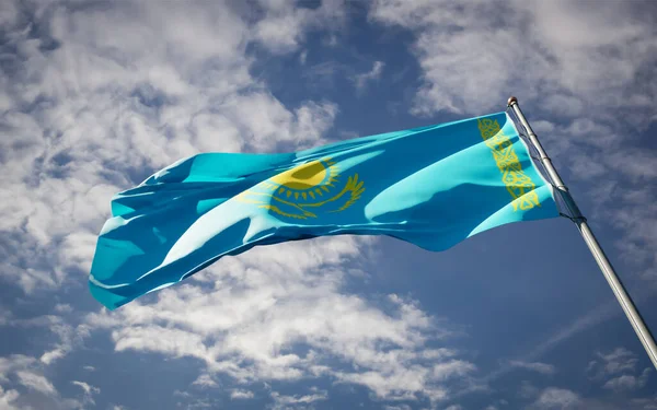 Beautiful national state flag of Kazakhstan fluttering at sky background. Low angle close-up Kazakhstan flag 3D artwork.