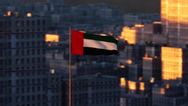 Cinematic flyover of the beautiful waving UAE flag in the dusk sky. — Stock Video