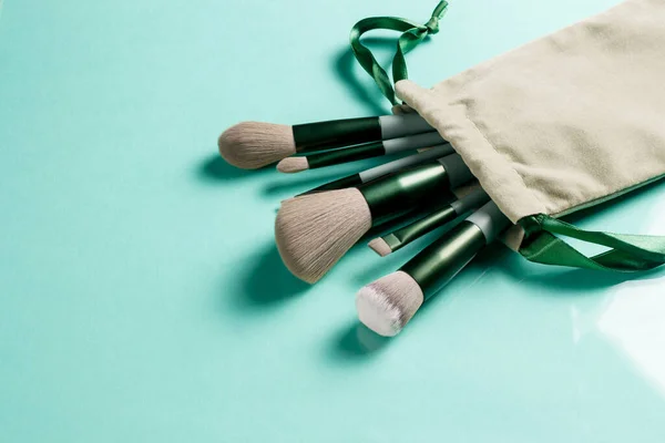 Makeup Brush Set Turquoise Background Copy Space Isolated Side View — Stock Photo, Image