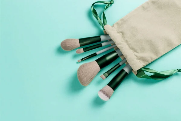 Makeup Brush Set Turquoise Background Copy Space Isolated Top View — Stock Photo, Image