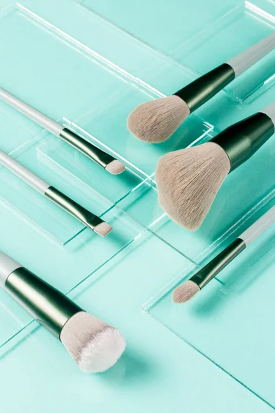 Flat Lay Makeup Brushes Pieces Glass Turquoise Background Cosmetic Products — Stock Photo, Image