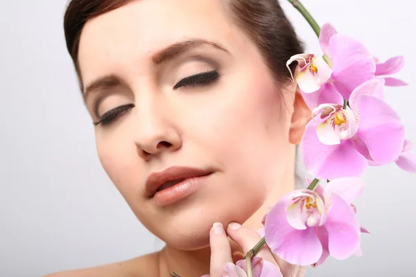 Beautiful Girl With Orchid Flowers. — Stock Photo, Image