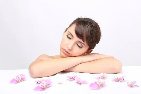 Spa salon. Girl lying on a massage table — Stock Photo, Image