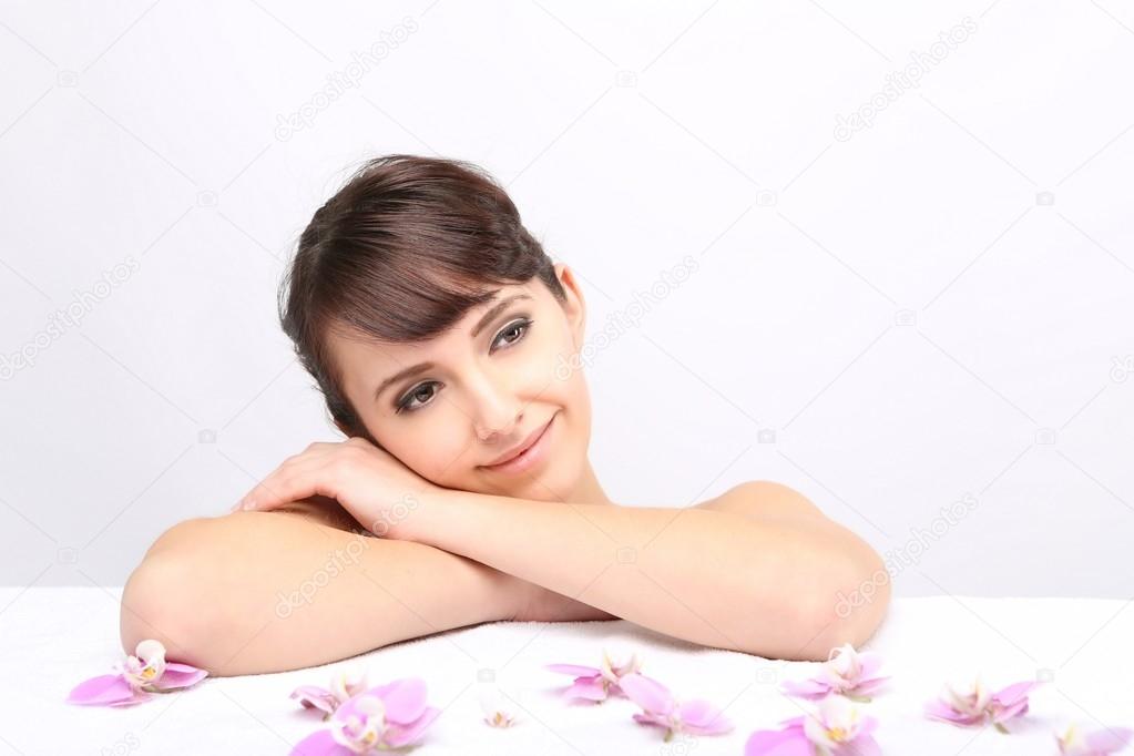 Spa salon. Girl lying on a massage table