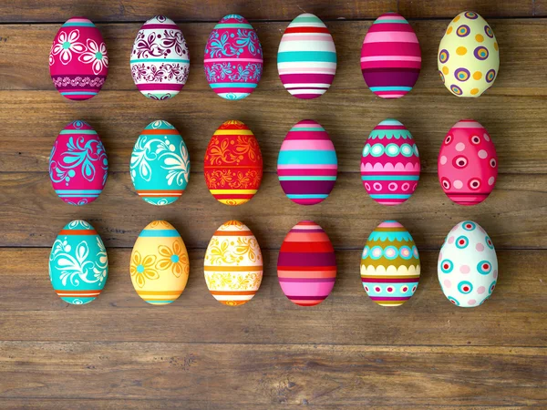 Ovos de Páscoa em fundo de mesa de madeira — Fotografia de Stock