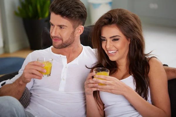 Young couple on the sofa — Stock Photo, Image