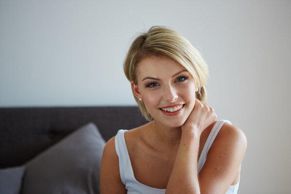 Woman relaxing on her bed